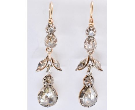 A pair of 19th century gold and diamond earrings. The earrings having rose, pear and round cut diamonds in closed back settin