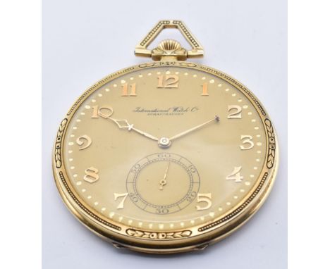 A 14ct gold International Watch Co - Schaffhausen open faced pocket watch. The watch with cathedral hands having arabic numer