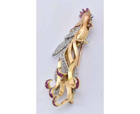 An 18ct gold ruby and diamond figural brooch. The brooch in the form of a bird of paradise set with single cut diamonds and c