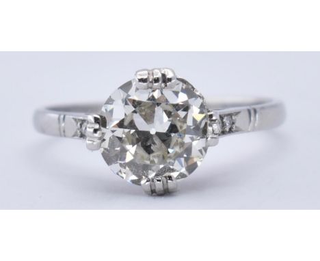 A platinum and diamond solitaire ring. The ring set with&nbsp; a large old cut diamond being 7.4mm x 7.4mm x 3.9m, estimated 