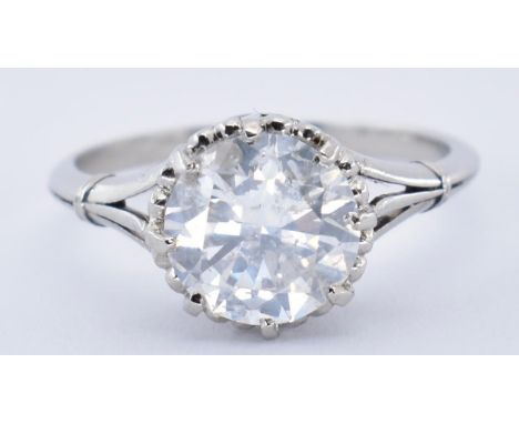 A platinum and diamond solitaire ring. The ring set with a round brilliant cut diamond in a pierced heart gallery setting to 