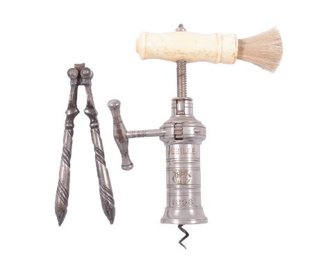 A rack and pinion corkscrew with brush and bone handle, pair of nutcrackers.