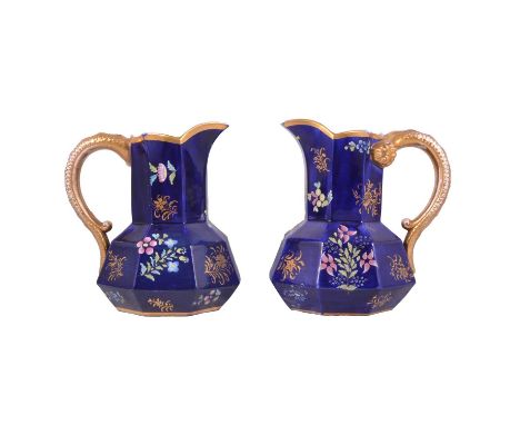 A pair of 19th century Spode hydra shaped jugs with gilded snake handles, blue ground with painted floral and gilt decoration