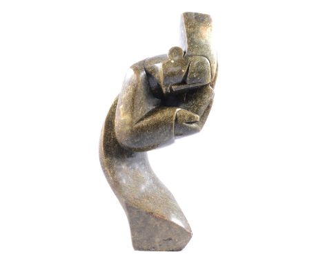 Tonderai Mashaya, a lemon opal Shona Sculpture of a sleeping figure, signed, 49.5cm.Condition report:There are some scratches