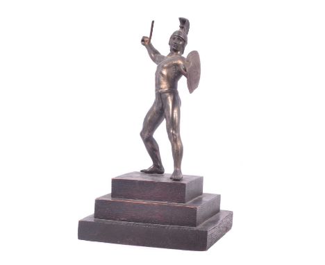 Small patinated spelter figure of a Grecian warrior, on stepped wooden base, 22cm.Condition report:Shield of a little bent an