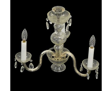 Glass three-light chandelier, cutglass column, three scrolled arms supporting cut glass sconces, with a bag of prismatic drop