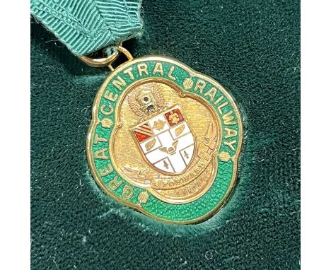 A Great Central Railway Gold Free Pass medal, Ian Allan Regalia, Birmingham 1993, the 9 carat yellow gold medal with red and 