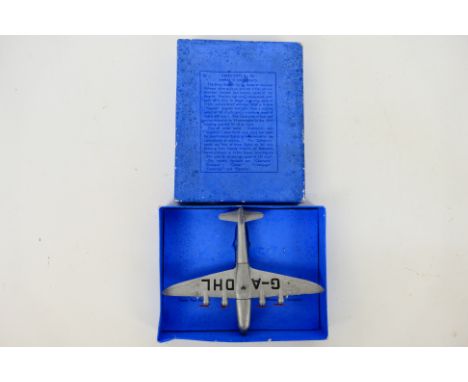 Dinky - An Empire Flying Boat # 60r. The model appears in Good condition overall but has a small repair to the tailplane and 