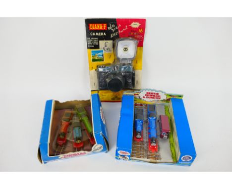 Ertl, Other - Lot includes 2 x boxed Ertl Thomas the Tank Engine die-cast sets and a blister-packed Diana-F toy camera made i