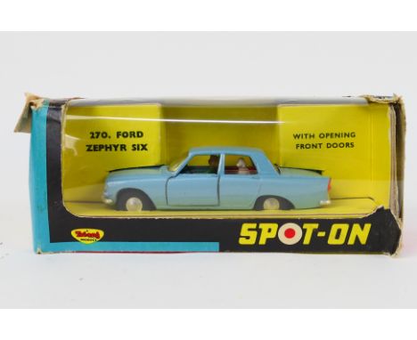 Tri-ang Spot-On - A boxed Ford Zephyr Six in light blue with lady driver and dog passenger # 270. The car appears in Near Min