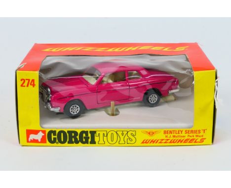 Corgi - A boxed Bentley T Series Mulliner Park Ward in bright pink # 274. The model appears Near Mint with just s few tiny ma