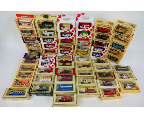 Lledo - A boxed collection of 60 diecast model vehicles from Lledo. Lot includes Canadian Provincial Series 'Northwest Territ