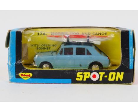 Tri-ang Spot-On - A boxed Morris 1100 in light blue with roof rack and canoe # 274. The car appears in Mint condition in a Fa