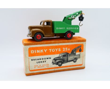 Dinky - A boxed Commer Breakdown Lorry in a very dark shade of the usual tan cab with red wheels and a green back. # 25x. The