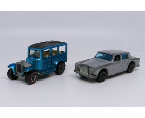 Hot Wheels - Two unboxed vintage Hot Wheels model vehicles, including 'Classic 31 Ford Woody' in metallic light blue, texture