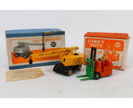 Dinky - 2 x boxed models, a Coles Mobile Crane # 571 and a Coventry Climax Fork Lift Truck # 14c. They appear in Very Good co