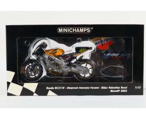 Minichamps - A  boxed #122027146 Honda RC211V, Repspl Honda Team, Rider: Valentino Rossi, MotoGP 2002. The model appears Mint