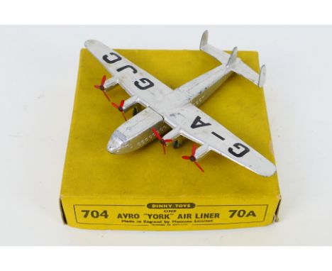 Dinky - A boxed Avro York Airliner # 704. The model appears in Very Good condition with light signs of use in a Good yellow b
