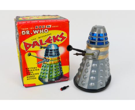 Marx - A boxed battery powered Dr. Who TV series Dalek by Marx dated 1964. The model appears in Very Good condition with ligh