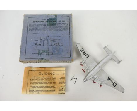 Dinky - A rare boxed Junkers JU90 Airliner # 62n. The model appears in Very Good condition overall with the metal hook and th