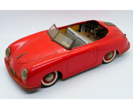 Distler (Germany) - An unboxed vintage battery operated Porsche from Distler. The model in red has some pieces missing and sh