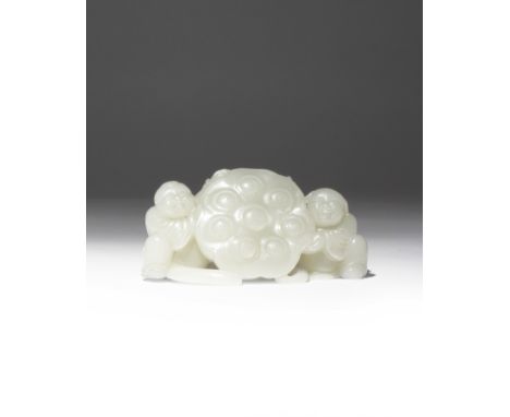 A CHINESE PALE CELADON JADE 'LOTUS AND BOYS' CARVING QING DYNASTY Formed as two kneeling children resting their hands on a la