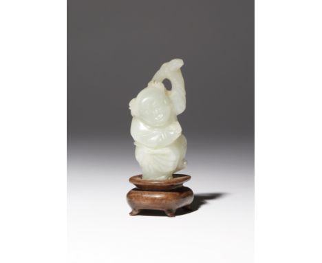 A SMALL CHINESE PALE CELADON JADE CARVING OF A BOY QING DYNASTY The smiling child depicted standing holding a ruyi sceptre ov