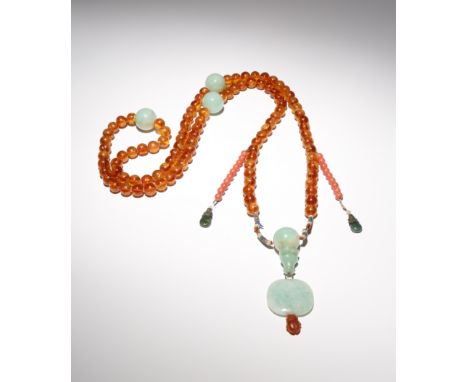 A CHINESE AMBER AND JADEITE CEREMONIAL COURT NECKLACE 19TH CENTURY The ninety-eight amber beads divided by three apple green 