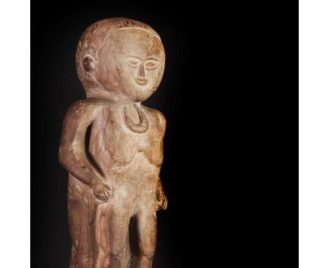 A limestone 'Pokapoko Ingiat' spirit figure,Papua New Guinea, with shortened limbs and an enlarged head, wearing a 'shell and