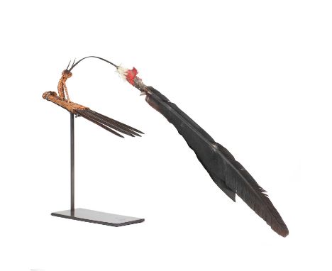 A men's hair comb,early 20th century, Papua New Guinea Highlands, with a dancing feather bird,39cm long, on a modern display 