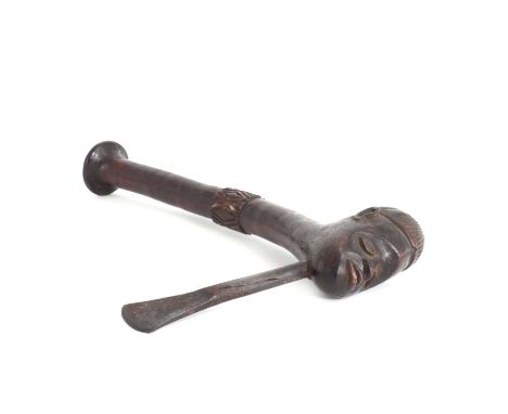 A West African hardwood axe,with a steel blade, issuing from a carved head,38cm longCondition ReportWear and patination sugge