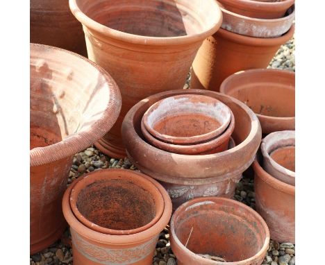 A large group of terracotta wares,with moulded borders and sides,larger planter 46cm diameter33cm high (24)Condition ReportOn