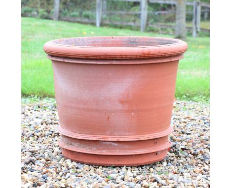 A large Whichford Pottery terracotta planter,of cylindrical form, impressed mark, planted with bulbs,60cm diameter48cm high