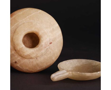 An Ancient Egyptian alabaster cosmetic container,probably early Dynastic period, c.2920-2575BC, formed from two worked pieces