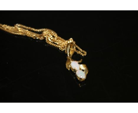 A TWIN OPAL PENDANT ON CHAIN 
