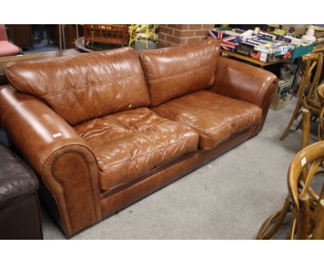 A MODERN BROWN LEATHER THREE SEATER SOFA