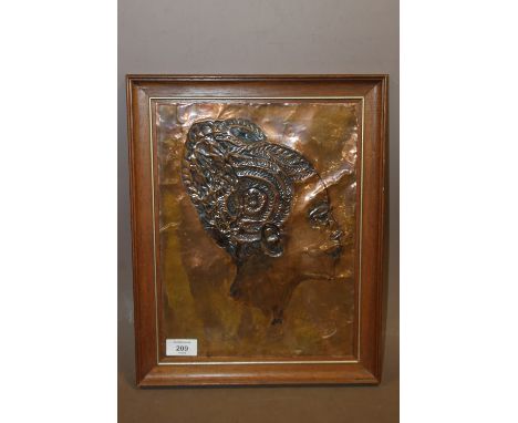 AN ARTS AND CRAFTS STYLE PROFILE PORTRAIT OF A LADY ON COPPER 