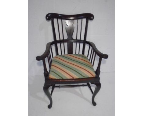 An antique Welsh comb style mahogany carver.