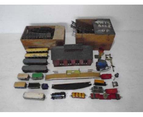 A large collection of vintage Hornby/Meccano O gauge model railway including a locomotive (82011), carriages including two Pu