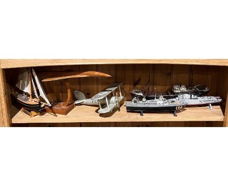 A selection of wooden and plastic scale model kits including a wooden Concorde, Royal Navy amphibious assault ship HMS Fearle