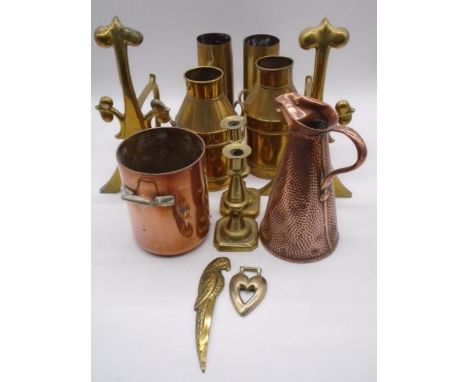 An assortment of copper and brass including an Elkington &amp; Co copper pot marked Union-Castle line, fire dogs, candle stic