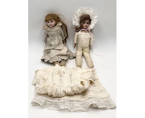 Two antique bisque headed dolls - one marked for Armand Marseille and the other with indistinct but similar marks