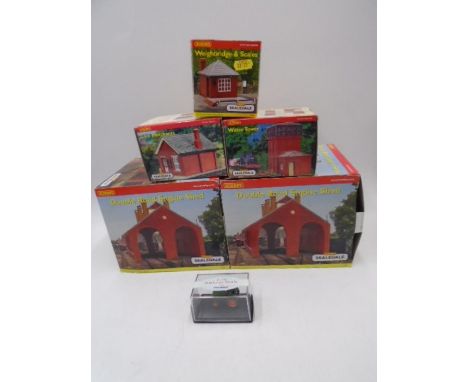 A collection of five boxed Hornby Skaledale OO gauge scale model buildings including two Double Road Engine Sheds (R8581), Wa