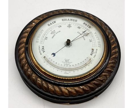 A circular barometer with Reaumur thermometer in wooden rope-twist surround