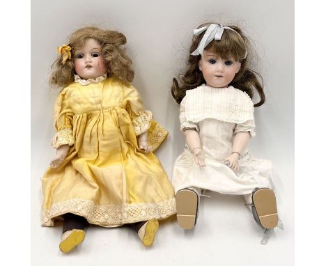Two antique Armand Marseille bisque headed dolls numbered 370 and 390