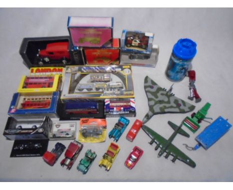 A collection of various die-cast model vehicles including Matchbox Models of Yesteryear, Moonbo Mini Train Set, Dinky, two pl