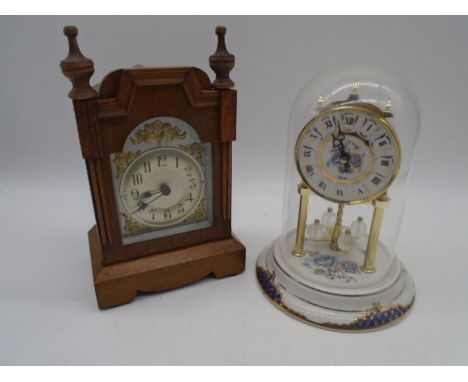 An anniversary clock on porcelain base along with a and mantle clock with silvered dial