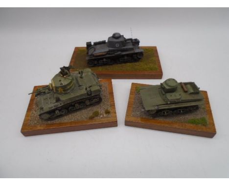 A collection of three WW2 tank dioramas (1:35 Scale) including a German Penzer 35T, American M3A1 Light Tank &amp; Soviet T-3