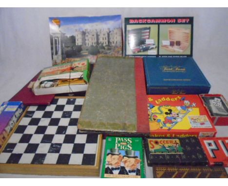 A collection of vintage games including chess, backgammon, Totopoly, Trivial Pursuit, Jenga, Walt Disney Snake &amp; Ladders,