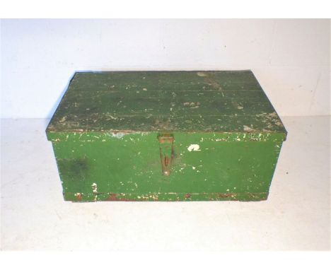 A vintage green painted storage trunk.